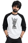 I Love Punk Raglan T-Shirt – Product Feature Young male model wearing a loose black and white raglan T-shirt featuring a skeleton hand punk graphic with “I LOVE PUNK” design