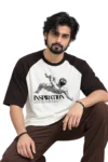Inspiration Raglan T-Shirt – Product Feature Male model wearing a loose cream and dark raglan T-shirt featuring a classical figure and “INSPIRATION” graphic