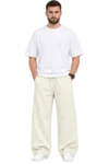 Wide-Leg Relaxed Fit Pants – Bairaagi Male model wearing cream-colored wide-leg relaxed fit pants with an elastic drawstring waist, styled with a white oversized T-shirt and white sneakers.